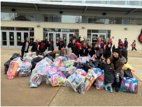 Cheer and Soccer teams collecting toys children. University of Louisvile, Kyle's Korner for Kids